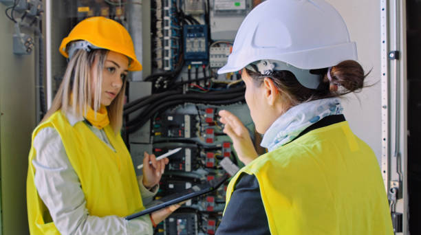 istock Female engineers working in solar power plant. Teamwork. Renewable energy systems. Solar city. 1362449144