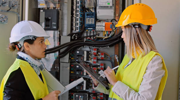 istock Female engineers working in solar power plant. Teamwork. Renewable energy systems. Solar city. 1362449157