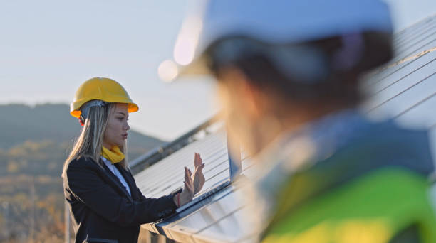 istock Female engineers working in solar power plant. Teamwork. Renewable energy systems. Solar city. 1362449178