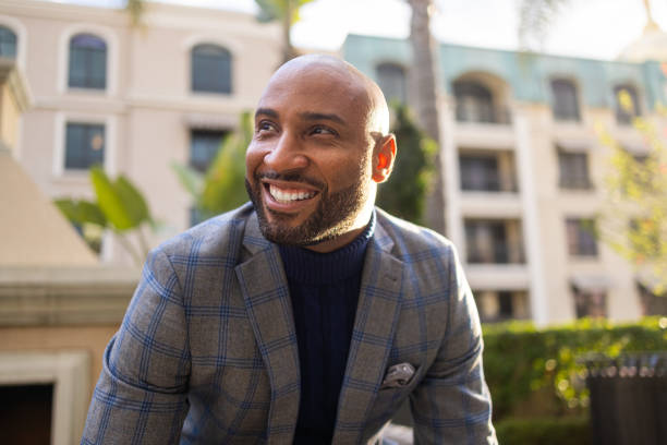 Portrait of a Fashionable Young Black Man A young fashionable black man businessman happiness outdoors cheerful stock pictures, royalty-free photos & images
