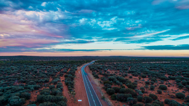 Drone Shot of the Sun setting on Goldfields Highway South Australia Drone Shot of the Sun setting on Goldfields Highway South Australia western australia stock pictures, royalty-free photos & images