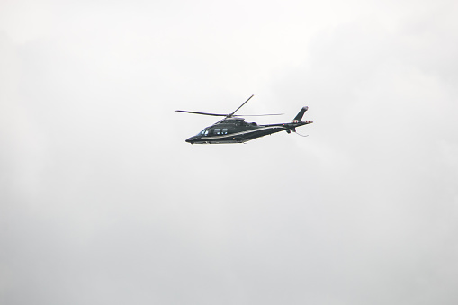 helicopter model Agusta A109S Grand in the sky over Rio de Janeiro.