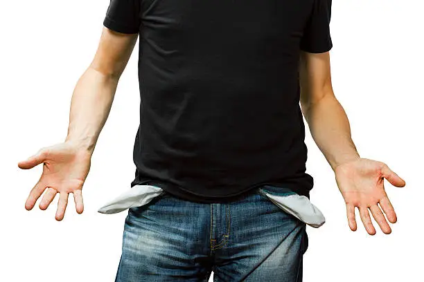 Photo of man showing his empty pocket, no money