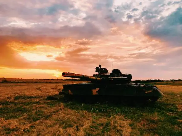 Real Military Tank in Sunset Light With Ray Of Sun