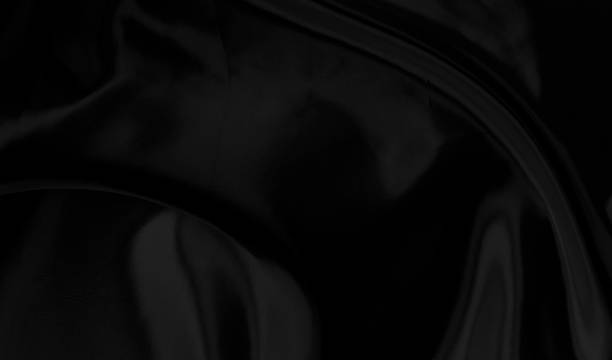 istock Black gray satin dark fabric texture luxurious shiny that is abstract silk cloth background with patterns soft waves blur beautiful. 1362468499