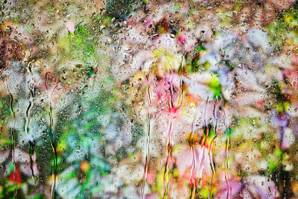 istock Abstract multicolored background behind fogged glass. 1362473924