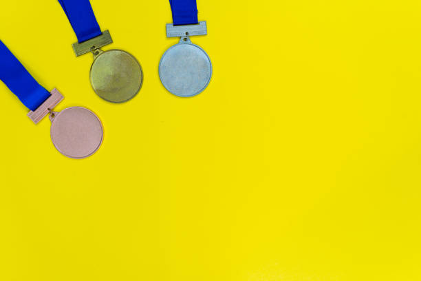 istock Bronze, Silver and Gold Medal mockup on yellow trending background with copyspace or text flat lay. 1362474163