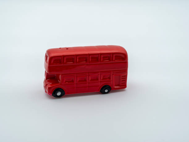 istock Vintage red salt shaker shaped as a London double decker bus. Mini salt shaker on white background. Collector's item 1362476763