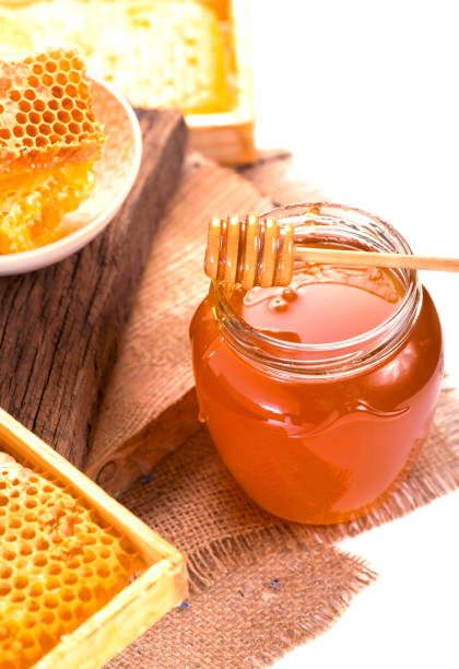 istock glass pot with floral honey isolated on white background 1362477049