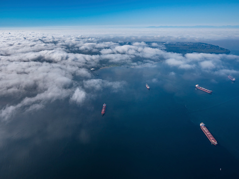 Stock aerial photo of scattered clouds over English Bay dotted with freighters, Canada