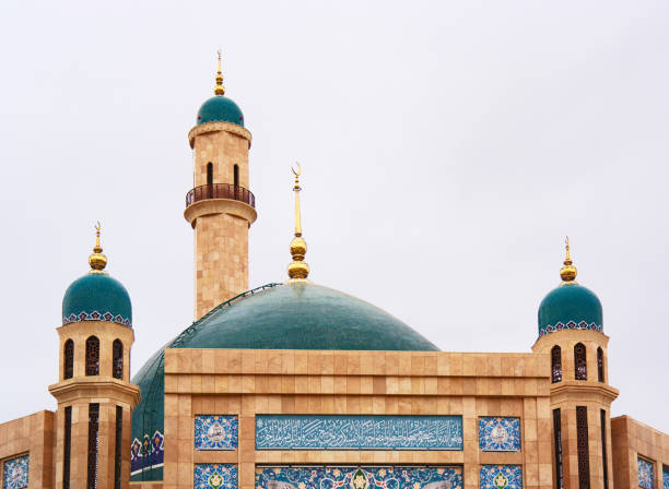 istock A new mosque with beautiful green domes on minarets. 1362480986