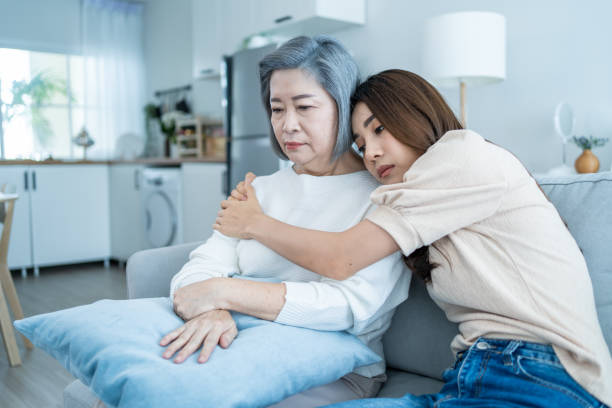 istock Asian loving daughter comforts upset elderly mother crying for problem. Young caring woman support, consoling and understand empathy to stressed senior older mom in tears at home. Family relationship. 1362484655