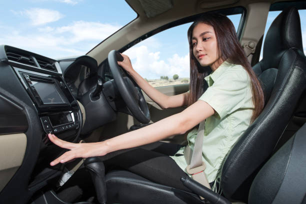 istock Asian woman adjusting air conditioning 1362485039