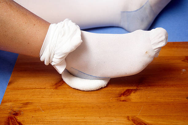 istock Closeup of total knee replacement patient exercising 136248576