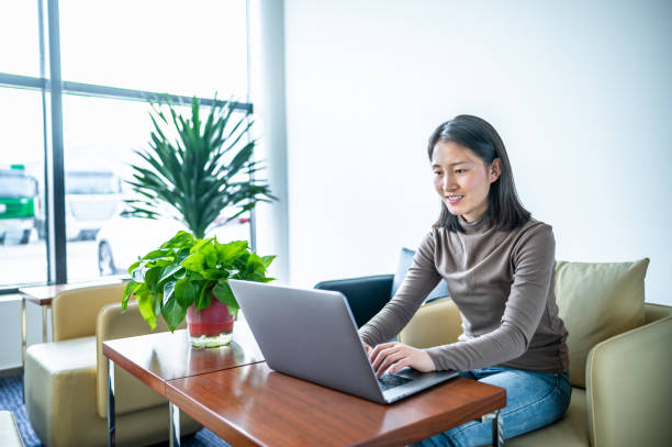 istock Young asian woman working in office 1362485880