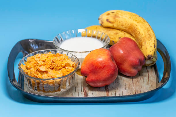 Healthy Indian breakfast of fruits milk and cereals stock photo
