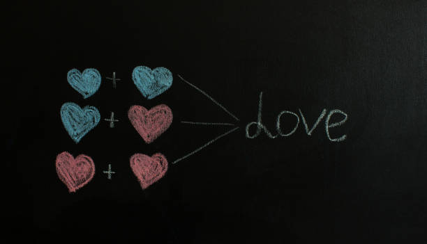 istock Blue and pink hearts are drawn on black chalkboard. 1362494380