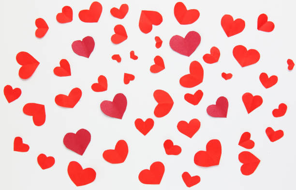 istock Many little red hearts on a white background. 1362494434
