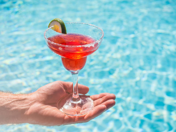 istock Beautiful glass with a refresh cocktail and an attractive man 1362495437