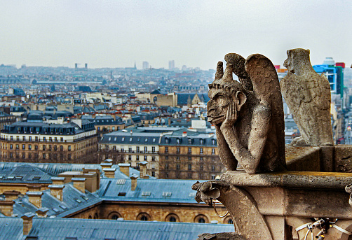 The gargoyle statue on the tower of Notre Dame de France