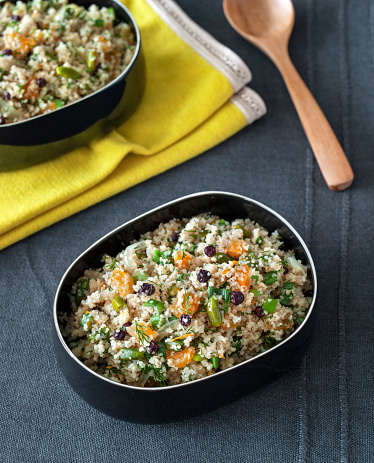 healthy fresh salad with bulgur wheat on a table setting