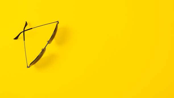 istock Sunglasses on yellow background. Minimalistic summer banner with copy space 1362504339