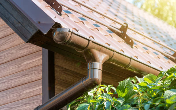 Tiled roof with segment of snow holding structure, Gutter system for metal roof. Holder gutter drainage system stock photo