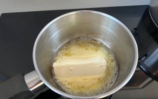 Lunch dinner - melted butter in a saucepan stock photo