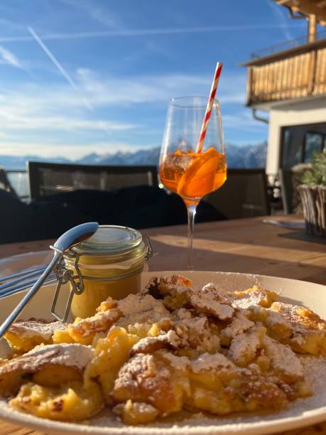 Lunch Dinner - Kaiserschmarren with Applesauce Icing Sugar Drink
in a style glass wine glass stock photo