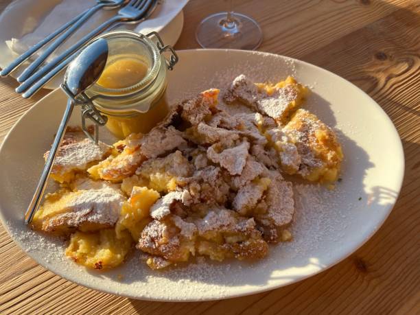 Lunch Dinner - Kaiserschmarren with applesauce icing sugar stock photo