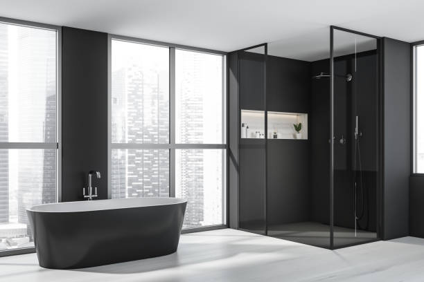 istock Corner view on dark bathroom interior with bathtub, shower 1362512667