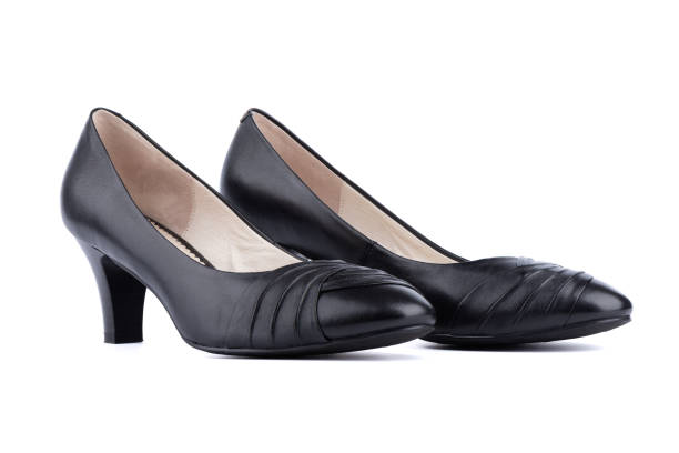 istock Women's black shoes are located side by side on a white background. 1362513906
