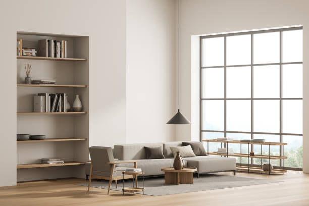 istock Bright living room interior with large sofa, armchair, panoramic window 1362514317