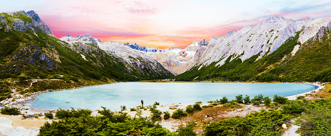 Sunset over Andes mountains and lake Laguna Esmeralda near Ushuaia in Tierra del Fuego, Argentina. Panoramic photo