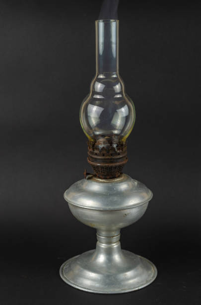 istock Faded Old kerosene lamp against a gray background. 1362517557