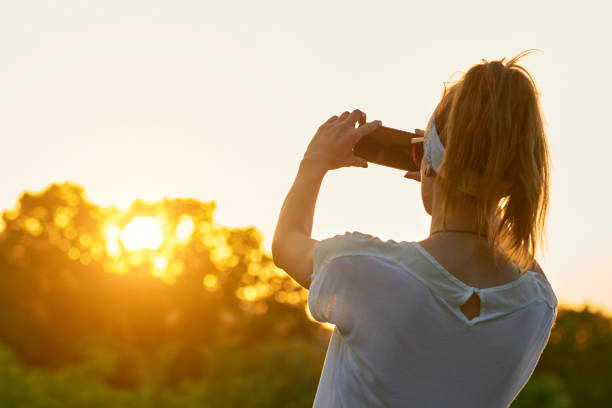 istock Female using modern smartphone outdoors. 1362517707