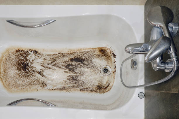 istock A bathtub with dirt due to a clogged sewer pipe and poor drainage, close-up 1362519762