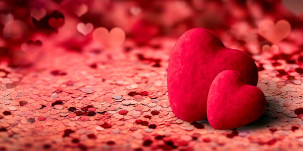 istock two red hearts on a background of red confetti blurred background. beautiful layout for valentine's day or wedding 1362520735