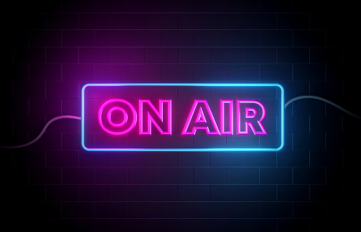 On-Air neon sign illuminated with blue and purple lights. Broadcasting concept
