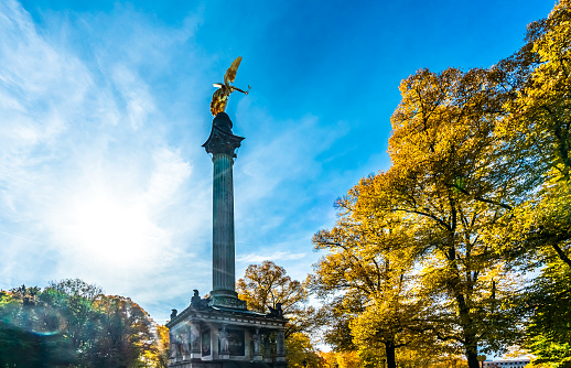Angel of Peace in Munich in autumnwith sunshine and beautiful clouds in the background. High quality photo
