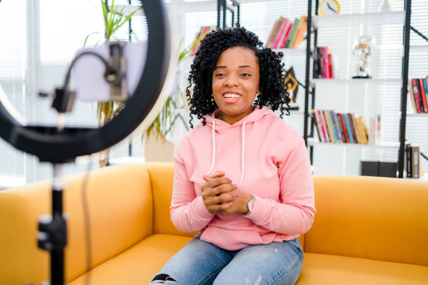 istock Smiling African influencer doing a vlog post in her living room 1362525871