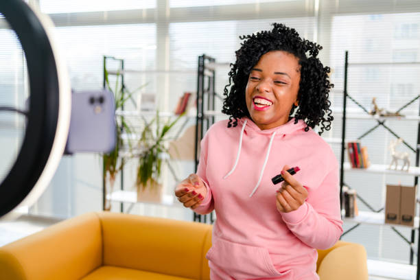 istock Smiling African influencer doing a vlog post in her living room 1362525875