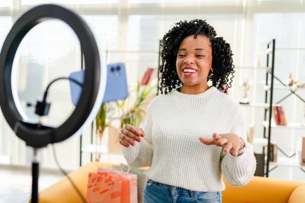 istock Smiling African influencer doing a vlog post in her living room 1362526473