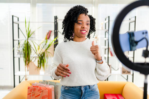 istock Smiling African influencer doing a vlog post in her living room 1362526574
