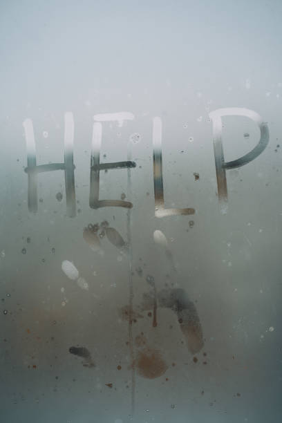 istock Help inscription and handprint on glass. 1362527486