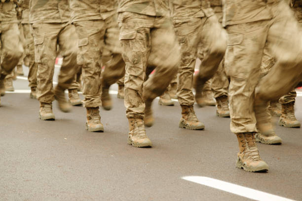 Feet of soldiers marching. Soldier's military boots.