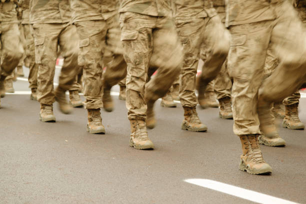 Feet of soldiers marching stock photo