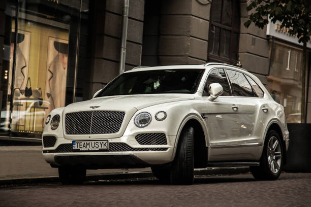 white english bentley bentayga suv parked in the city