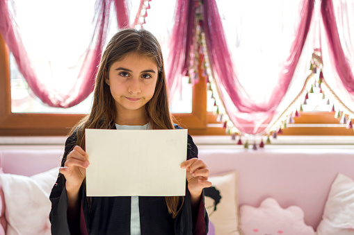 Happy beautiful girl holding empty blank