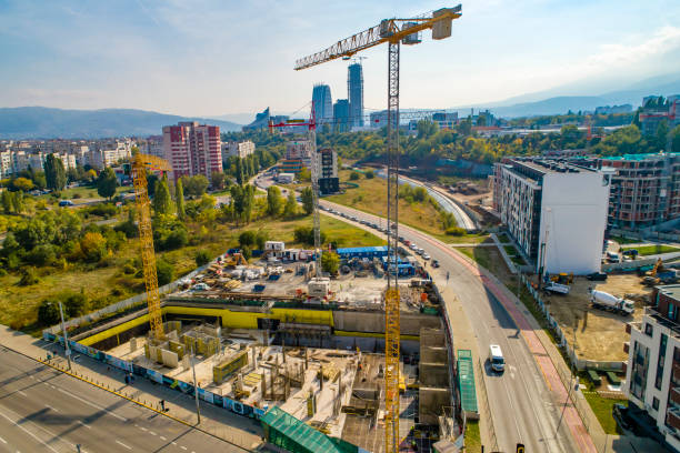istock Industrial construction cranes and construction in Sofia, Bulgaria. Aerial view of construction site and construction machinery. Drone point of view 1362531694